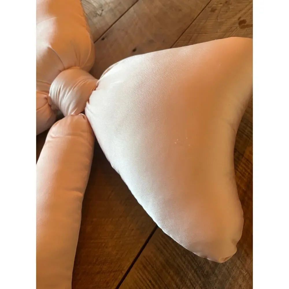 URBAN OUTFITTERS HOME light pink satin “BOW” throw pillow